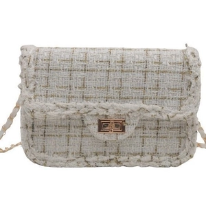 Classic cream woven tweed chain bag with elegant gold metallic turn-lock clasp