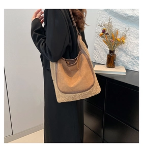 Detail of vintage beige faux shearling and brown suede patchwork tote shoulder bag