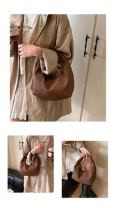 Close-up of brown crescent hobo bag featuring intricate geometric woven texture