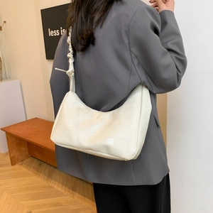 White quilted cloud shoulder bag with ruffled strap and crescent moon design