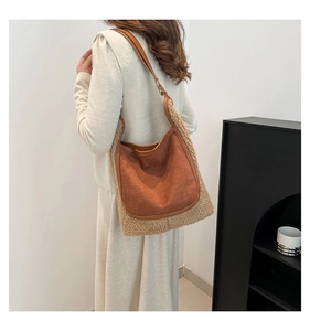 Detail of caramel suede and beige plush patchwork shoulder bag with leather strap