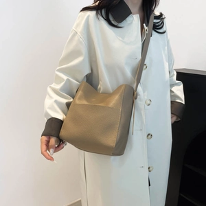 Khaki pebbled leather tote bucket bag with adjustable shoulder strap for daily commute