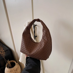 Minimalist coffee brown woven crescent hobo bag with a stylish knotted handle detail