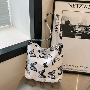 Sac fourre-tout blanc minimaliste avec imprimé papillon noir pour épaule de femme