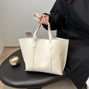 Minimalist ivory tote bag with vertical stitching and large capacity for women