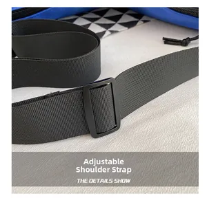 Detail of adjustable black nylon shoulder strap with buckle on minimalist blue crossbody bag