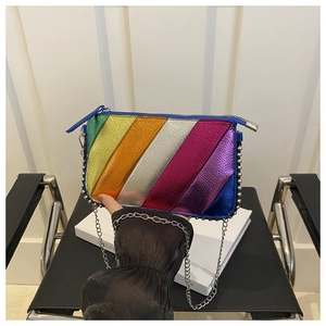 Close-up of rainbow metallic patchwork clutch with silver rivets and metal chain strap