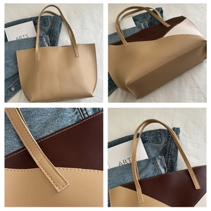 Detailed view of color-block tote bag stitching and premium leather texture in neutral tones