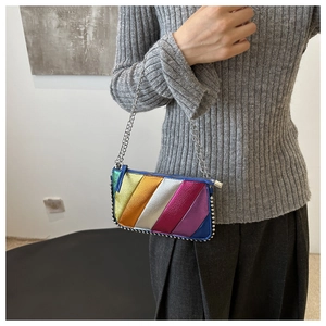 Detail view of rainbow metallic leather crossbody bag with silver studs and chain strap