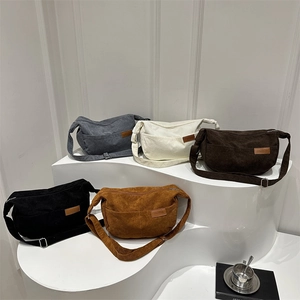 Minimalist corduroy crescent crossbody bag in multiple colors with fashion leather label