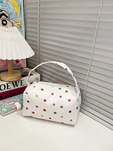 Minimalist white polka dot plush makeup bag with colorful spots and carry handle