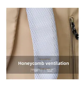 Close-up of thickened breathable honeycomb mesh shoulder strap on the khaki backpack