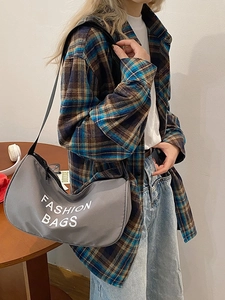Minimalist grey canvas hobo bag with adjustable strap and fashion lettering print