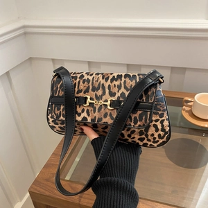 Retro leopard print shoulder bag with black strap and golden horsebit metal hardware