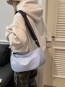 Minimalist light blue crossbody bag with adjustable strap and fashion bags print logo