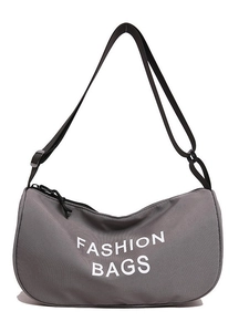 Minimalist grey crescent crossbody bag in durable fabric with white logo print and strap