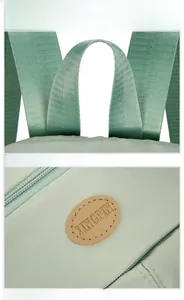 Detail of high-density waterproof nylon fabric with leather logo and sturdy top handle