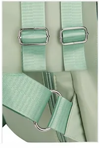 Detail view of adjustable nylon shoulder straps with reinforced silver metal buckles