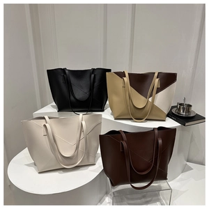 Showcase of minimalist large capacity tote bags in four colors with geometric stitching