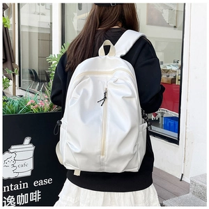 Close-up of minimalist white waterproof nylon backpack featuring sleek vertical zippers