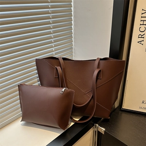 Minimalist large brown faux leather tote bag set with geometric stitching and pouch