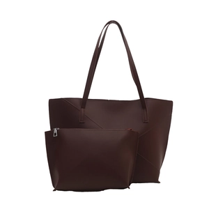 Minimalist large capacity faux leather tote bag with matching pouch and stitching detail