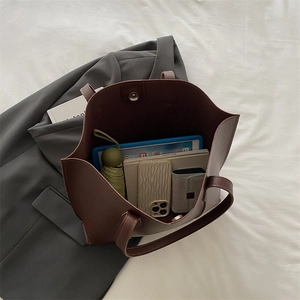 Top view showing the large capacity interior and magnetic clasp of the tote bag