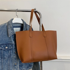 Retro caramel brown PU leather tote bag with large capacity and vertical stitching