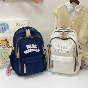 Large capacity navy and cream student backpacks for casual school or office commuting