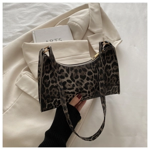 Detail of leopard print shoulder bag with zipper closure and adjustable strap