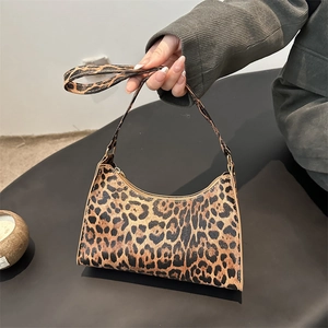 Classic leopard print underarm bag with zipper closure and slim crossbody strap