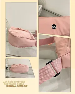Detail view of pink canvas bag showing interior capacity for umbrella and water bottle