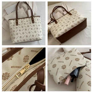 Detailed close-up showing printed tote bag textures, golden zippers, and inner pouch set