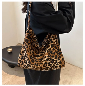 Detail of leopard print canvas tote bag featuring soft plush texture and large capacity