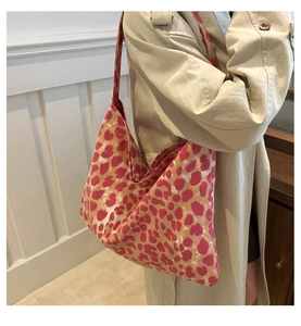Detail of large capacity canvas tote bag with pink and brown leopard print pattern