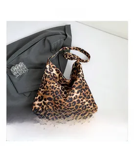 Detail view of the large capacity leopard print tote bag with soft fabric texture