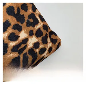 Close-up of the vintage leopard print fabric showing detailed woven canvas texture