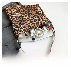Detail view of large leopard print tote bag interior showing spacious storage capacity