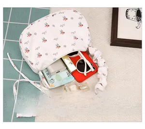 Interior view showing the large storage capacity of the floral ruched crescent bag