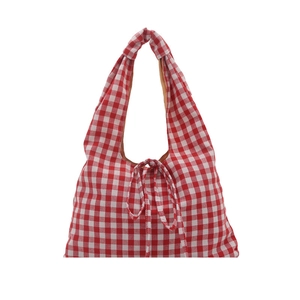 Plaid canvas tote bag in red and white checkers with casual drawstring shoulder straps