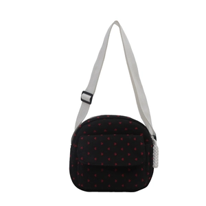 Sac en toile noir avec motif cœurs rouges et bandoulière blanche réglable