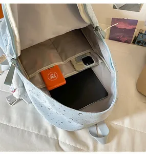Internal structure of the light blue star backpack showing compartments for tablets