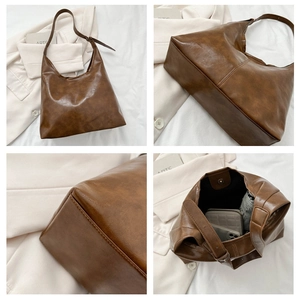 Detail showing the brown PU leather tote bag with wide shoulder strap and magnetic closure