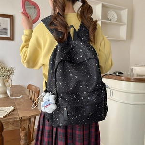 Black star and moon pattern backpack with cute plush charm for students and girls