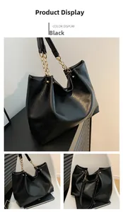 Détails du cabas en cuir ciré noir avec bandoulière en chaîne métallique et rivets