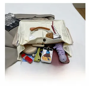Detail showing the large interior capacity of this corduroy tote bag for daily essentials