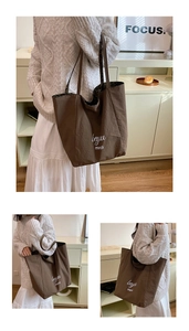 Detail of a brown canvas tote bag featuring leopard print lining and beyou merci print