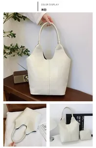 Detail of off-white tote bag set with geometric texture and small zipper pouch
