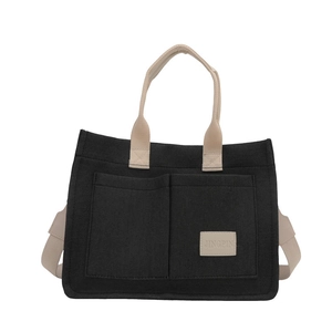 Sac fourre-tout minimaliste en toile noire avec deux poches et bandoulières beige