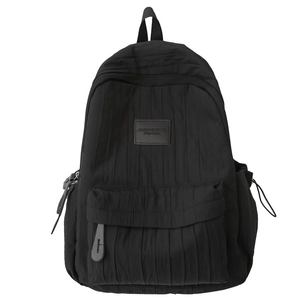Minimalist black backpack with pleated texture and stylish vertical wrinkles for students
